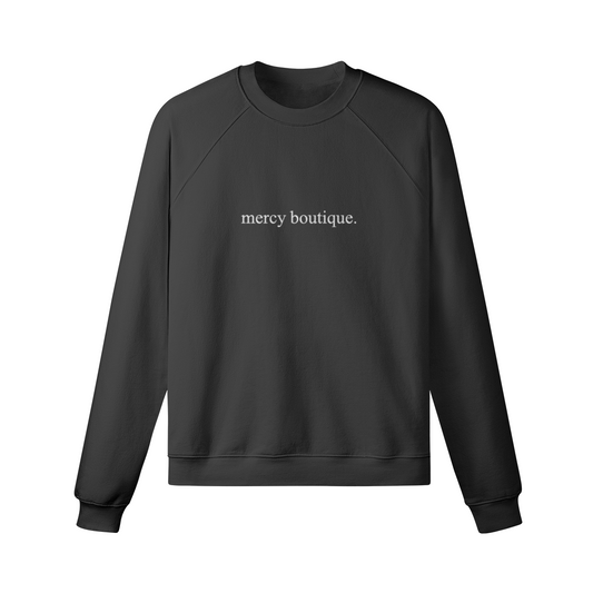 embroidered mercy boutique in white font.